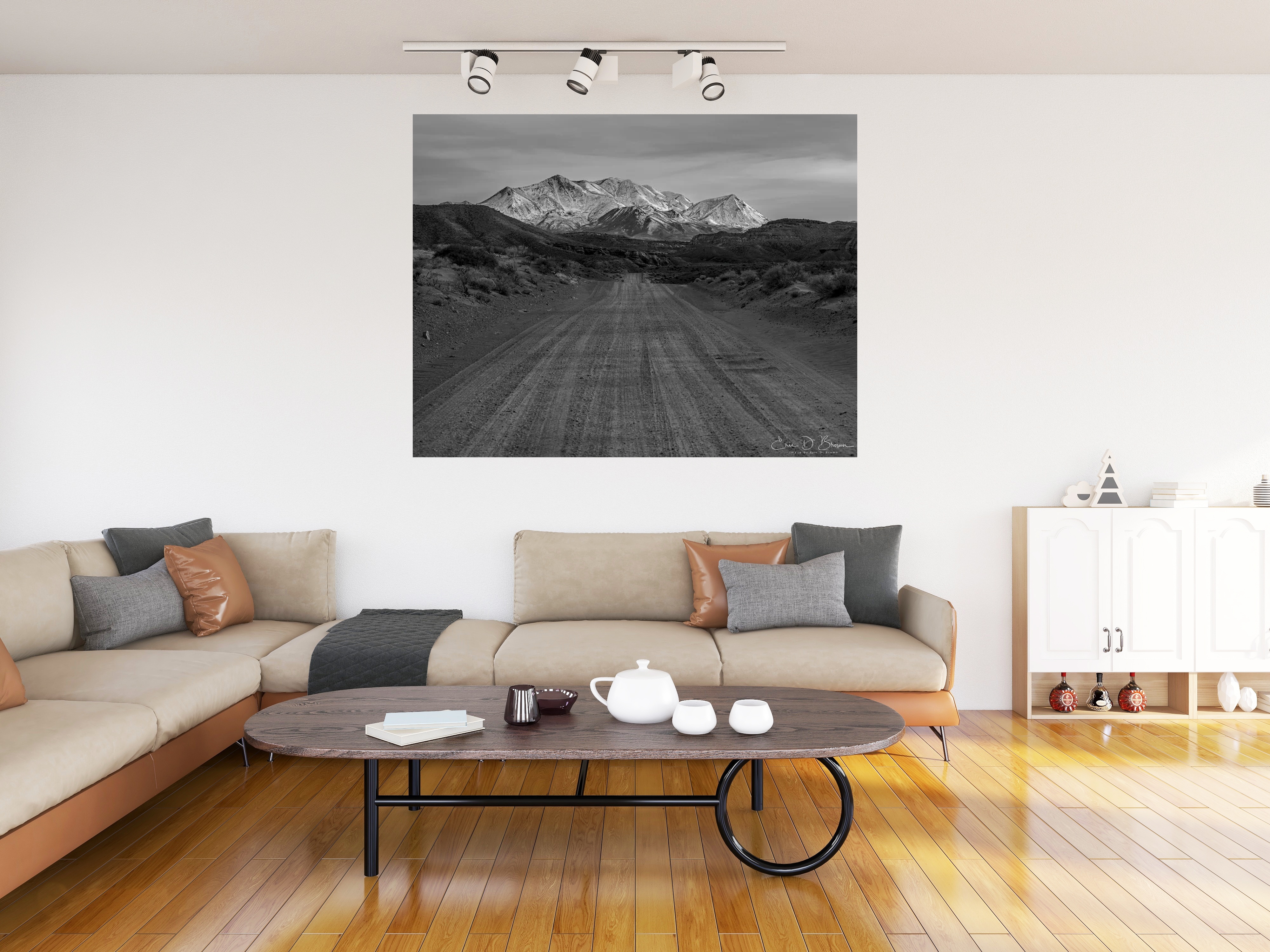 Room visualization showing The Road to the Henry Mountains hanging on a wall in a modern living room setting