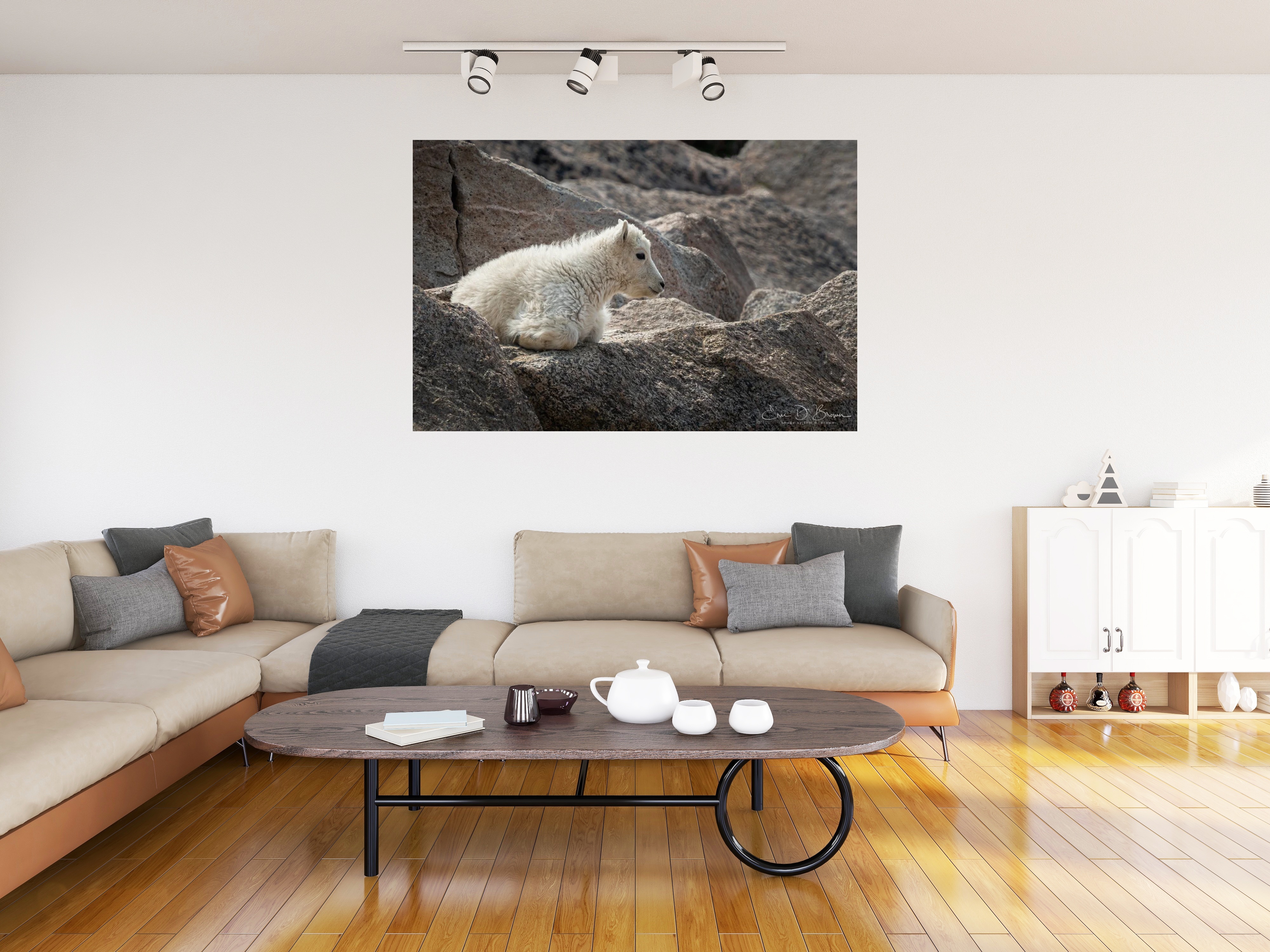 Room visualization showing Young Mountaineers: The Mountain Goat Kids of Mount Blue Sky hanging on a wall in a modern living room setting